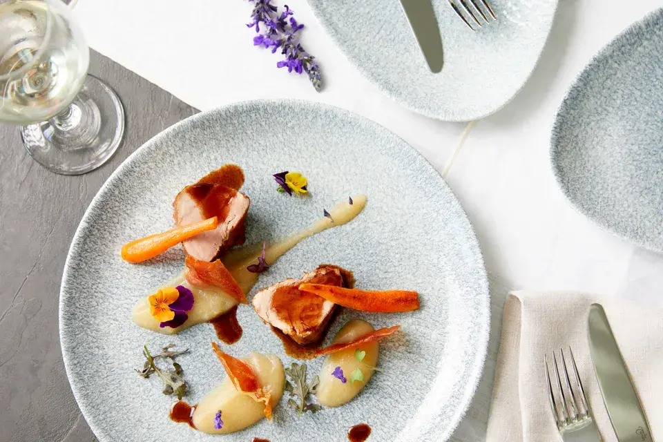 A close-up of a dish served on a plate in a hotel restaurant.