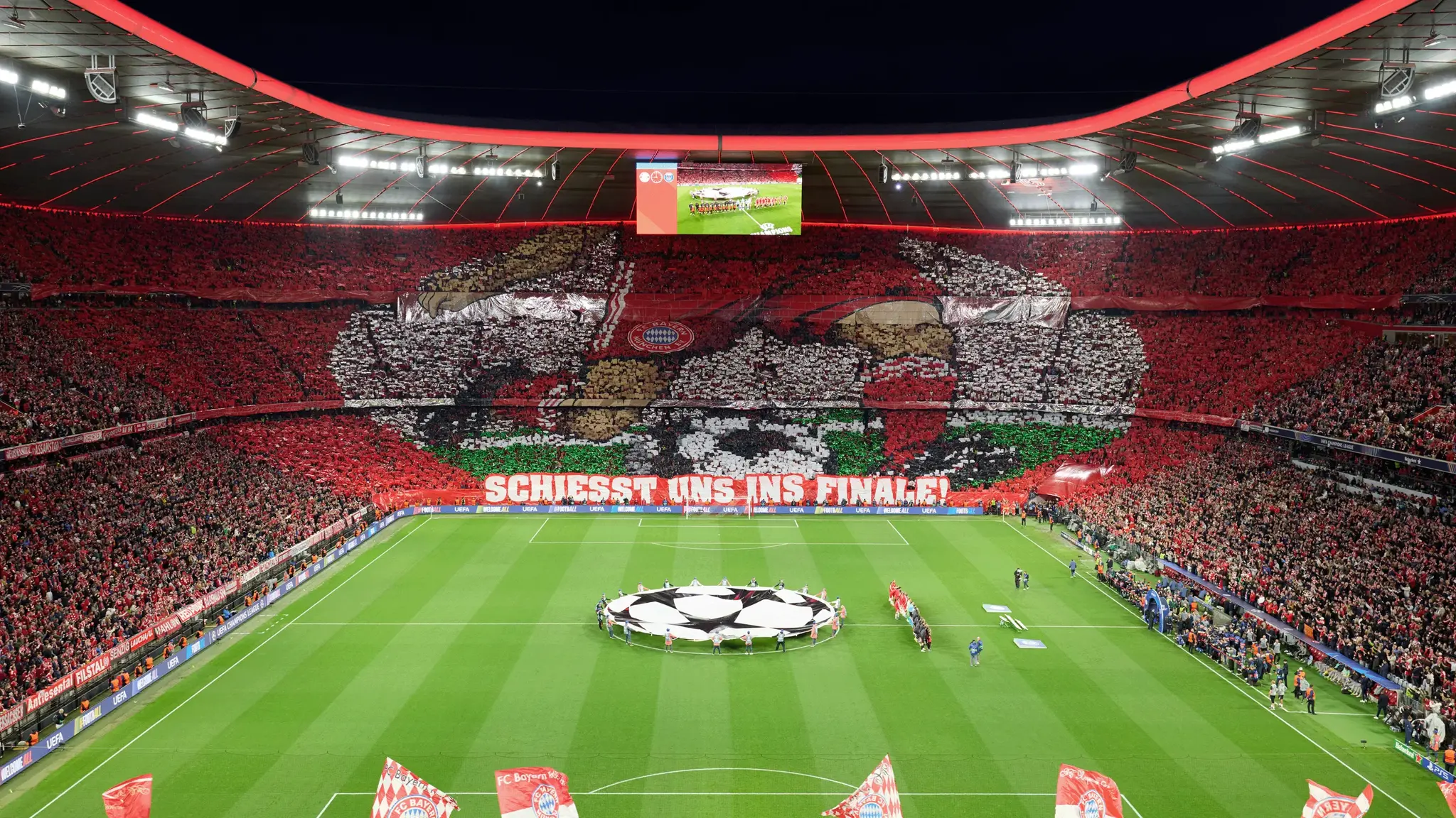 View of the pitch at Allianz Arena and fan choreography in the stands