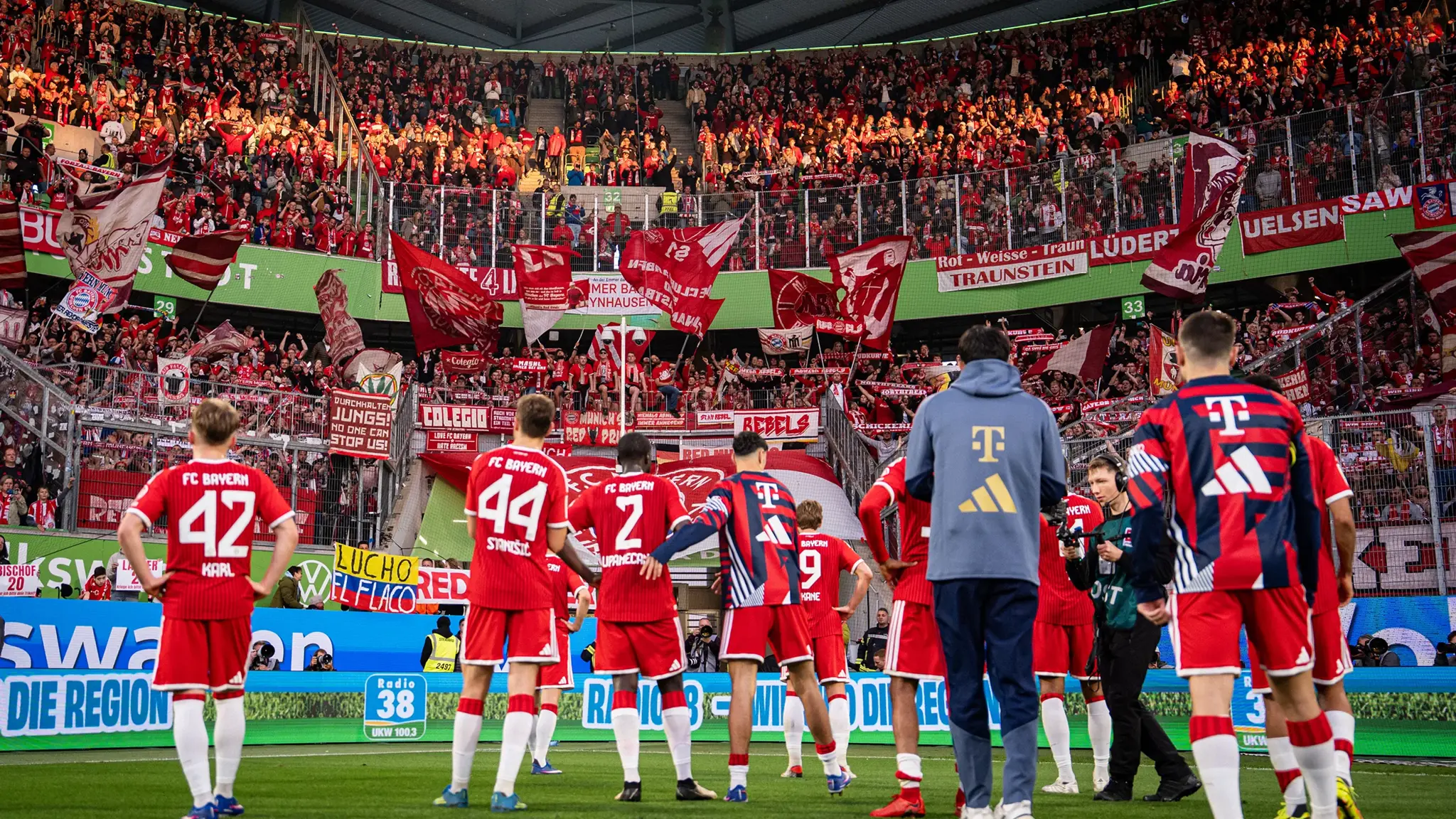 FC Bayern players in front of the away fans after the match against VfL Wolfsburg