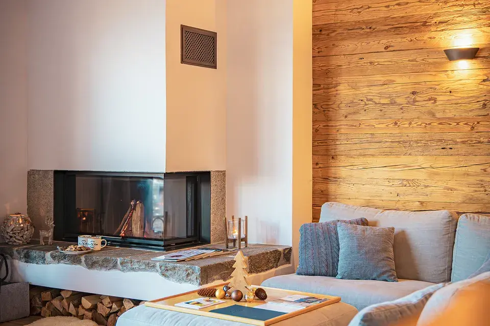 Living room with a couch and a fireplace