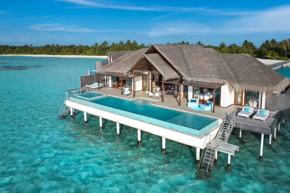 Ocean Pool Villa: An overwater villa at Niyama Private Islands Maldives, built on stilts above the lagoon, featuring a large terrace and a private pool directly above the turquoise waters.
