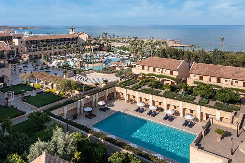 Poolside sun terrace at the Elysium with loungers and seating areas