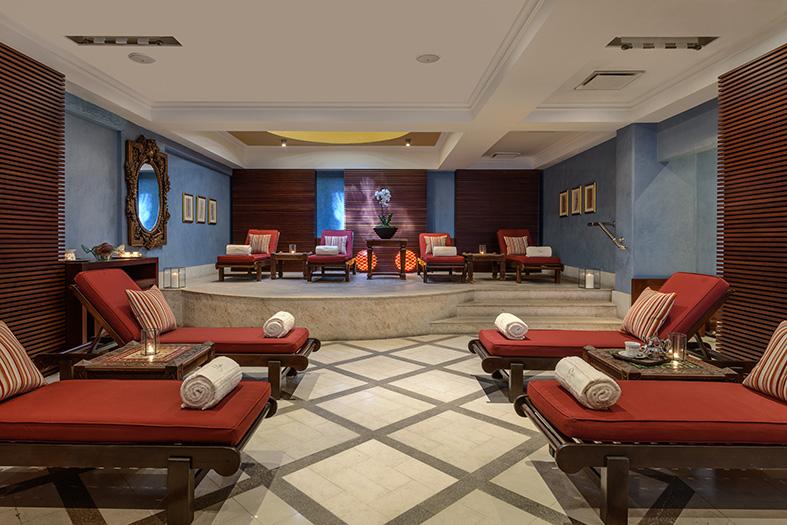 Spa relaxation area at the Elysium with loungers and seating