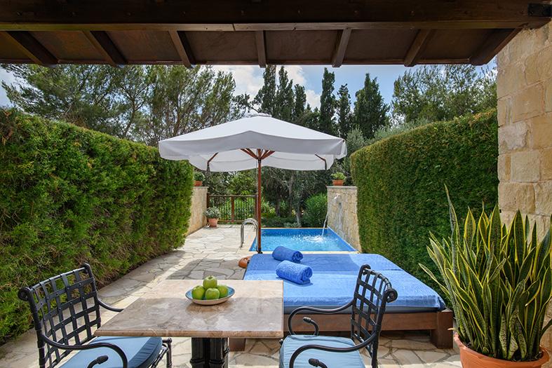 Royal Garden Villa Terrace with private pool, umbrella, and table with chairs